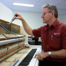 gary tuning a piano in his workshop